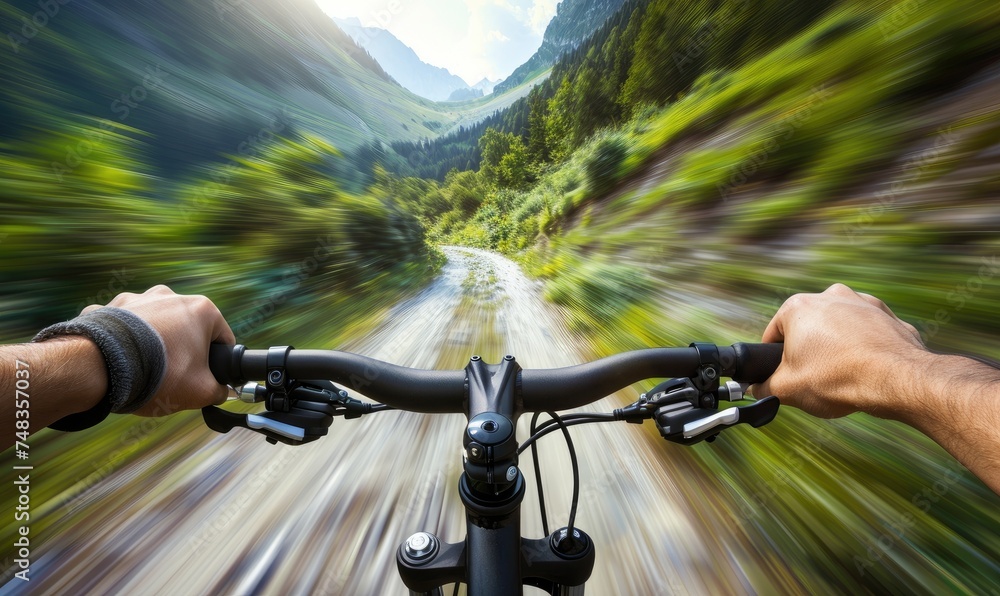 Rider driving bicycle in the mountains Rider driving bicycle in the mountains