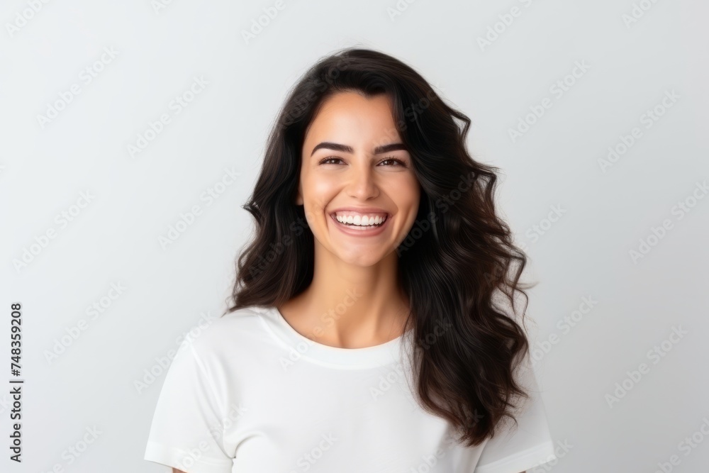 Portrait of a beautiful young happy smiling woman, over grey background Portrait of a beautiful young happy smiling woman, over grey background