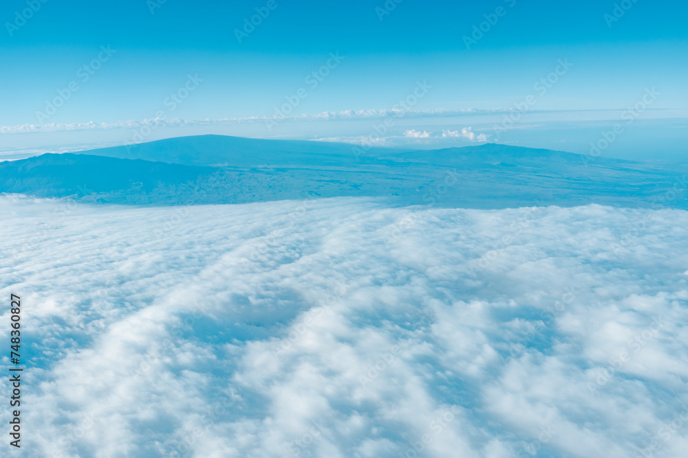 Aerial photography of Honolulu to Hilo from the plane. From left to right: Mauna Kea, Mauna Loa, and Hualalai. Hawaii island
Aerial photography of Honolulu to Hilo from the plane. From left to right: Mauna Kea, Mauna Loa, and Hualalai. Hawaii island