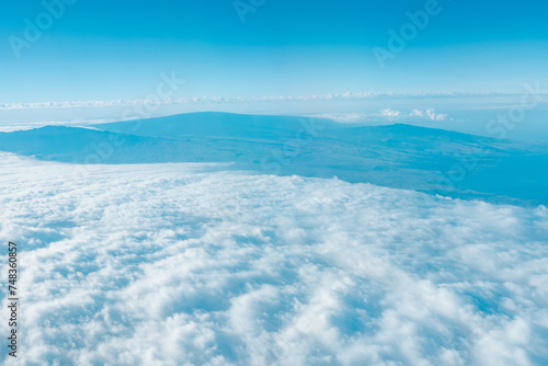 Aerial photography of Honolulu to Hilo from the plane.  From left to right  Mauna Kea  Mauna Loa  and Hualalai. Hawaii island 