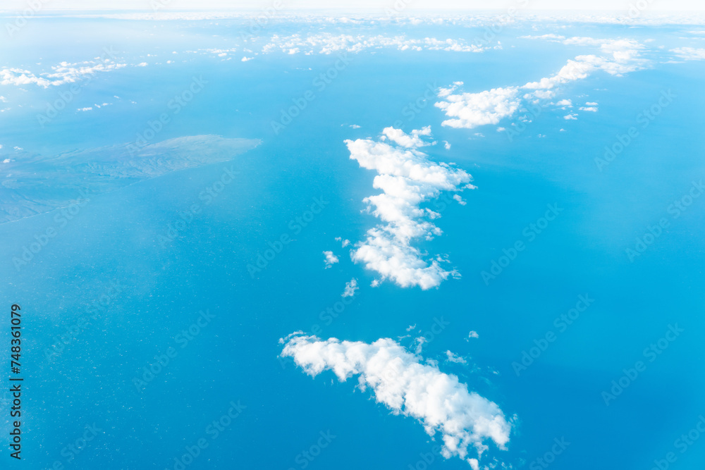 Naklejka premium Aerial photography of Honolulu to Hilo from the plane. Kahoʻolawe , anglicized as Kahoolawe is the smallest of the eight main volcanic islands of the Hawaiian Islands. 