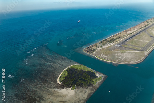 Daniel K. Inouye International Airport runway . Aerial photography of Honolulu to Hilo from the plane.
 photo