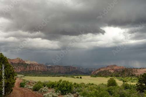 Summer Rain Drops over Field and Mountains of Zion