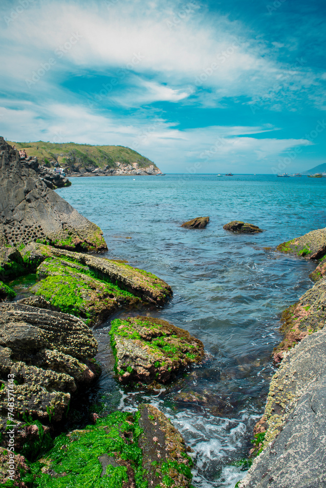 Part of Praia do Forte, with many rocks and mountains around, located in the city of Cabo Frio, Rio de Janeiro.