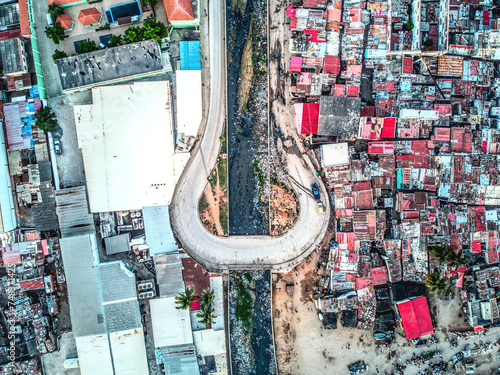 Urban Jungle: A Birds-Eye View of a Bustling Cityscape.
Swooping over a metropolis filled with towering skyscrapers, bustling streets, and intricate architecture, this aerial perspective offers a mesm photo