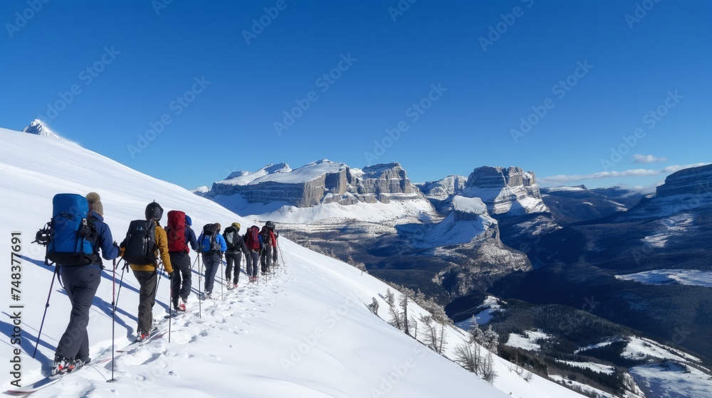 Group of Hikers Climbing Snow Covered Mountain