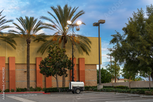 Portable mobile trailer with floodlight in a parking lot photo