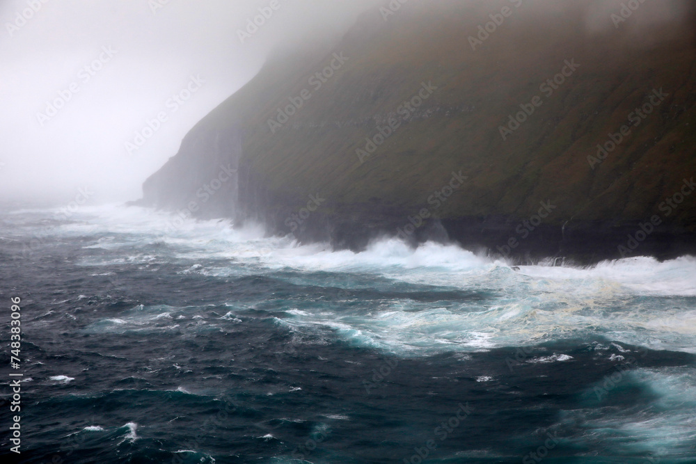 Waves crashing at the coastline of the Faroe islands