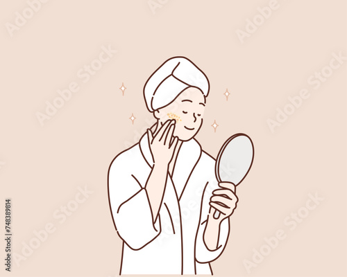 woman with healthy perfect smooth skin applying cream on cheeks, pretty young female with white bath towel on head looking in mirror in bathroom.Hand drawn style vector design illustrations.