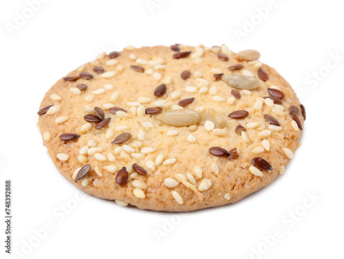 Round cereal cracker with flax, sunflower and sesame seeds isolated on white