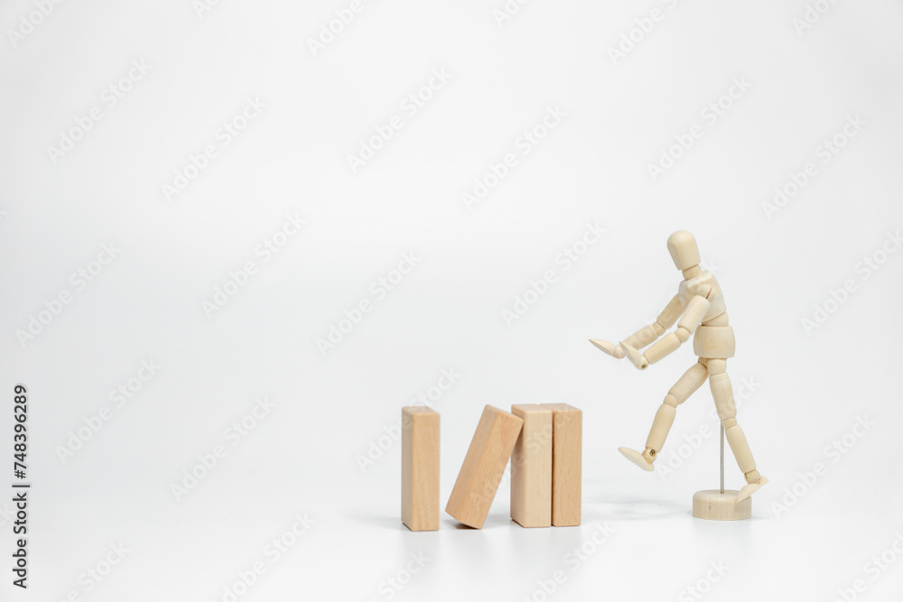 Wooden doll with wooden toy block isolated on white background. business or creative concept Wooden doll with wooden toy block isolated on white background. business or creative concept