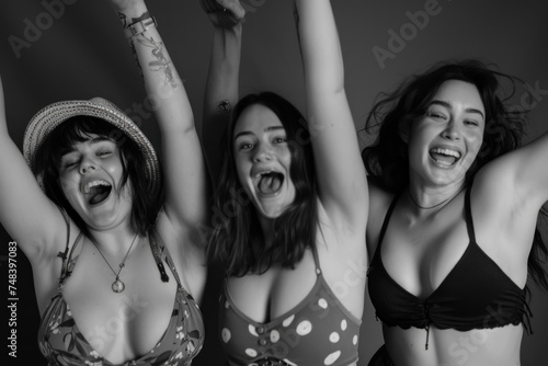 Monochrome Image of Three Joyful Women Celebrating Friendship with Elation