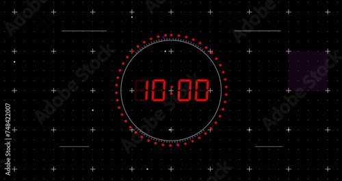 Image of red digital timer changing with dots and circles on black background