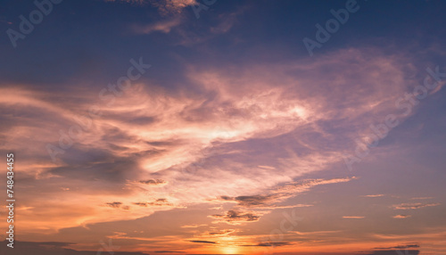 Panoramic view of sunset golden and blue sky nature background. Colorful dramatic sky with cloud at sunset.Sky background.Sky with clouds at sunset. © pinglabel