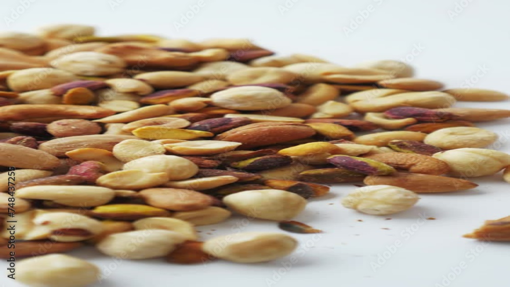 close up of many mixed nuts on white background close up of many mixed nuts on white background