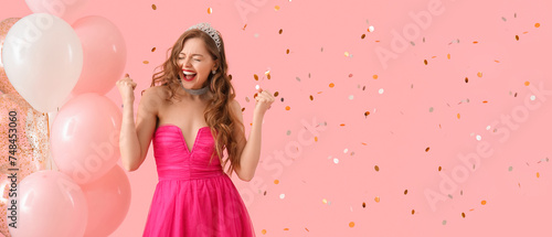 Happy young woman in prom d...