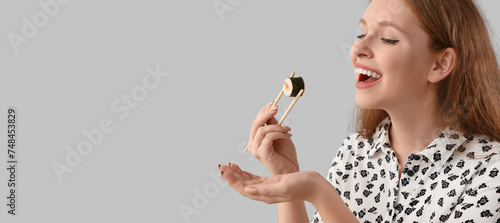 Young woman with tasty sush...