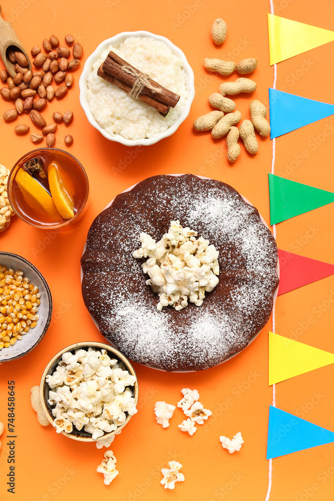 Traditional food with flags for Festa Junina (June Festival) on color background Traditional food with flags for Festa Junina (June Festival) on color background