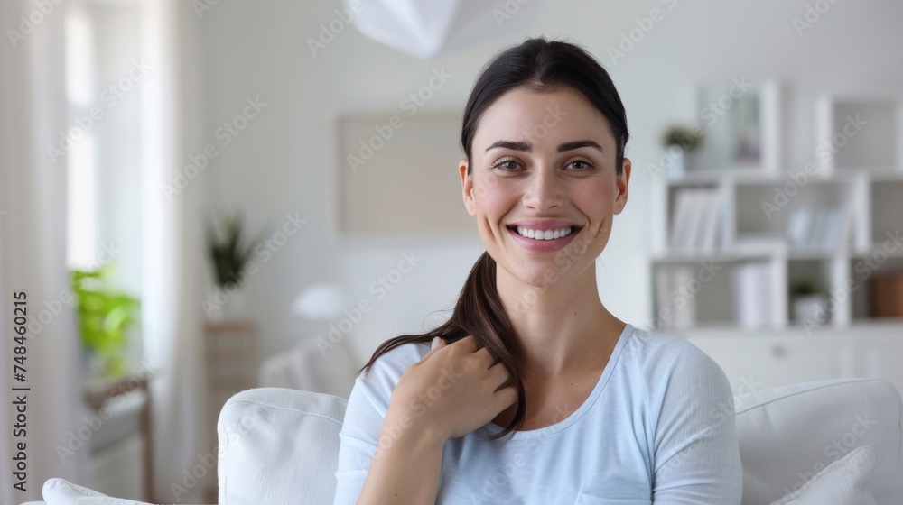 Smiling woman in living room, casual, comfortable, happiness, home interior, relaxed, modern Smiling woman in living room, casual, comfortable, happiness, home interior, relaxed, modern