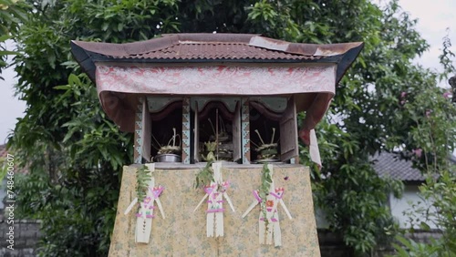 a Balinese Traditional Small Shrine with 3 Doors called Rong Tiga or Sanggah Kemulan photo