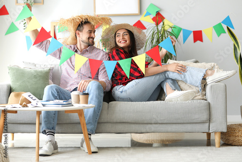Young couple with flags cel...