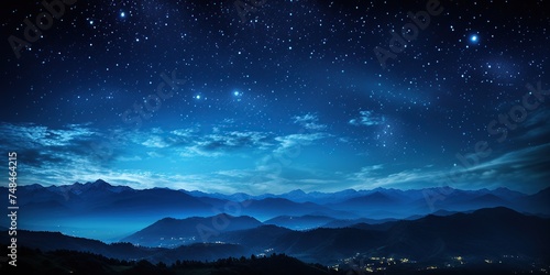 tranquil mountains and a starry sky at nightfall to vivid blue in the nighttime © Dament
