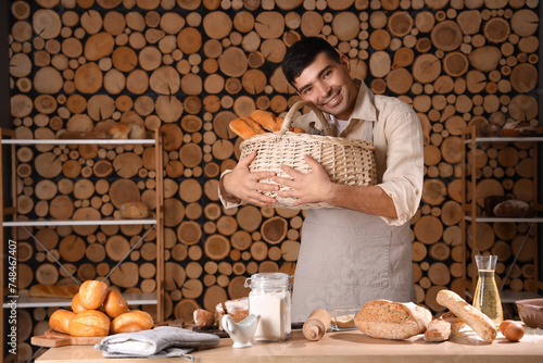 Young man with wicker baske...