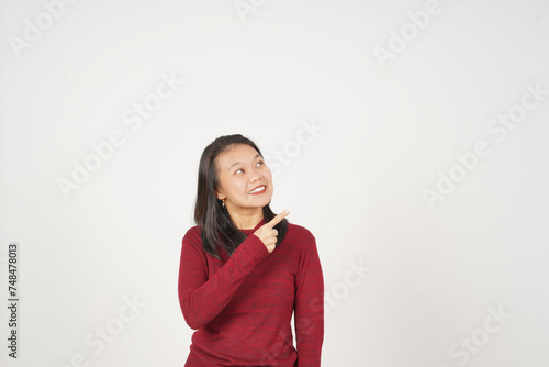 Young Asian woman in Red t-shirt pointing side copy space  isolated on white background © Sino Images Studio