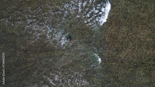 Overhead View Of Sea Waves On O‘ahu Island In Honolulu, Hawaii. Aerial Shot photo