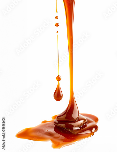 Thick caramel drizzle creating a tantalizing pool with droplets suspended in air, isolated on white background, ideal for dessert toppings concept with copy space