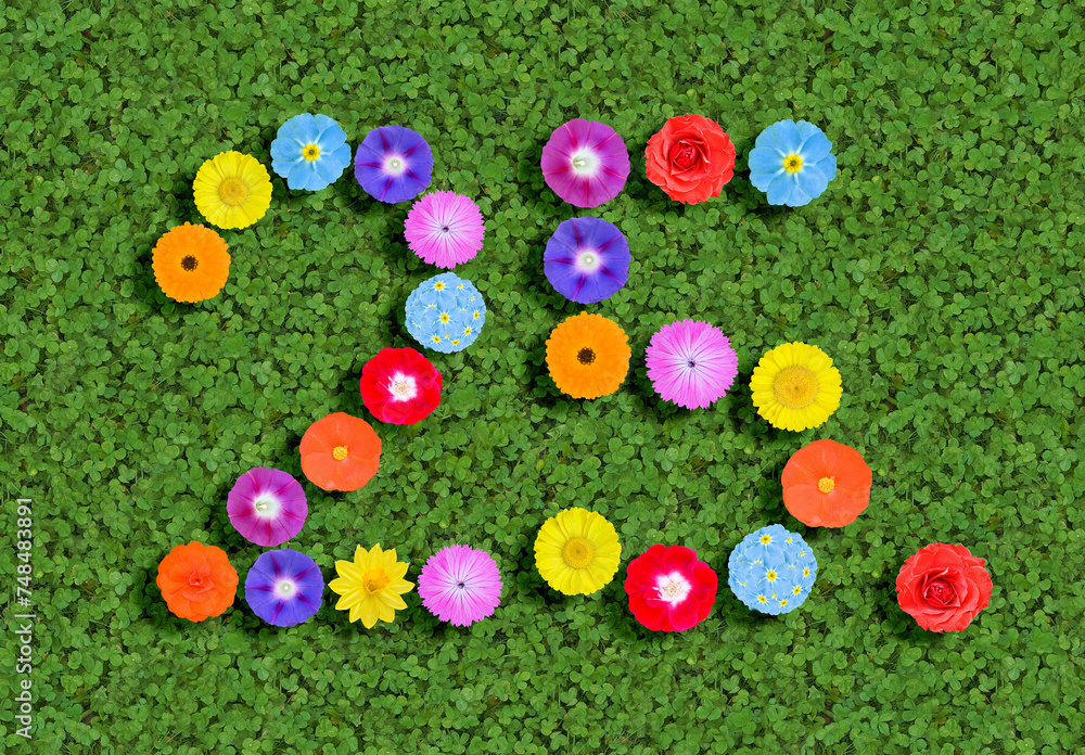 number written with colorful flowers on green clover background number written with colorful flowers on green clover background