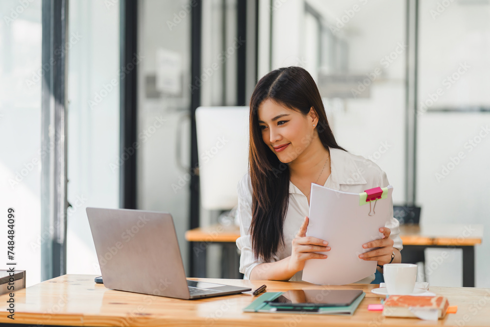 Organized Businesswoman Preparing Documents at workplace. Organized Businesswoman Preparing Documents at workplace.
