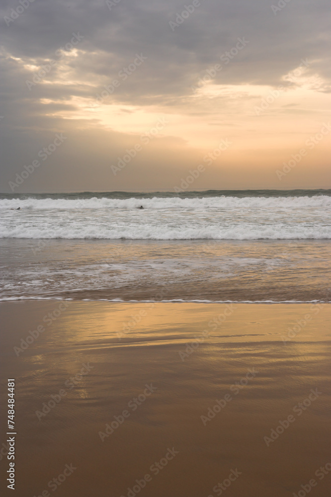 Beach, sunset and ocean on sand with clouds in sky on vacation, holiday on tropical island with rain. Sea, landscape and travel outdoor with calm waves, water and horizon in nature or environment Beach, sunset and ocean on sand with clouds in sky on vacation, holiday on tropical island with rain. Sea, landscape and travel outdoor with calm waves, water and horizon in nature or environment