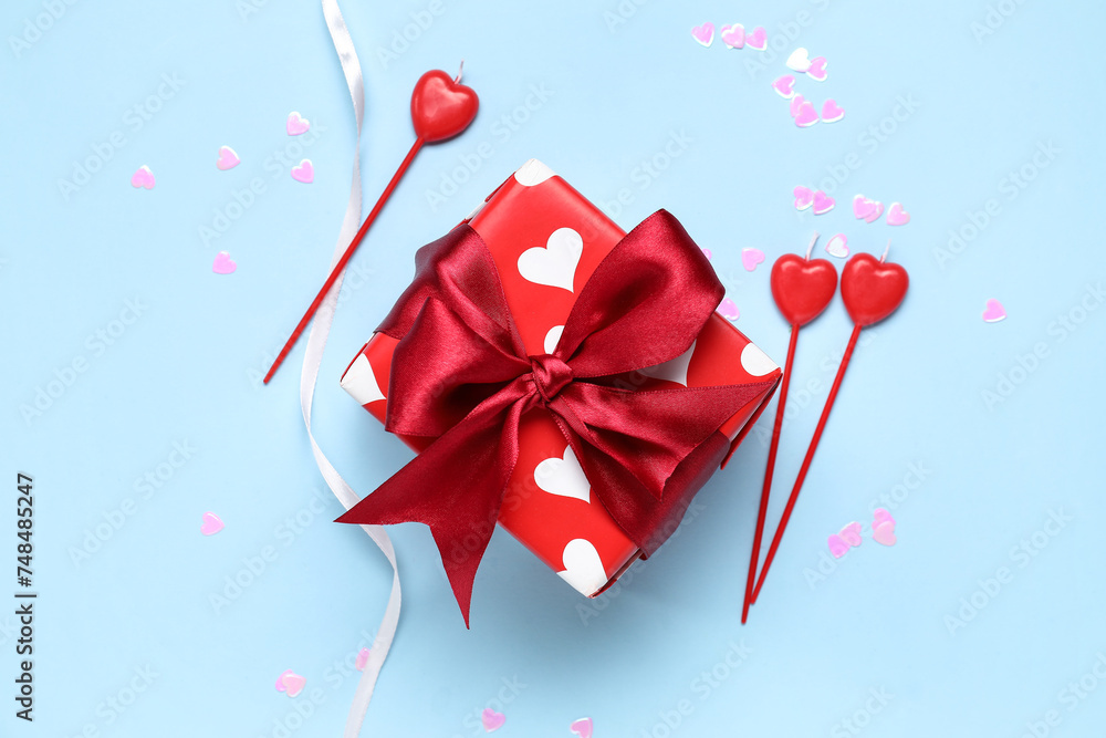 Gift box with hearts and ribbon on blue background. Valentine's Day celebration Gift box with hearts and ribbon on blue background. Valentine's Day celebration