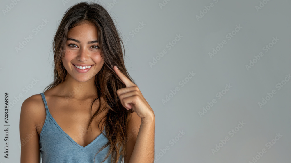Hispanic woman in blue ribbed V-Neck Body, hands in point away pose Hispanic woman in blue ribbed V-Neck Body, hands in point away pose