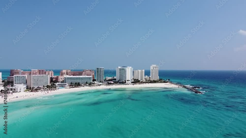Luxury hotel at Cancun Bay along white beach, Mexico. Aerial forward ascending and blue sky for copy space Luxury hotel at Cancun Bay along white beach, Mexico. Aerial forward ascending and blue sky for copy space