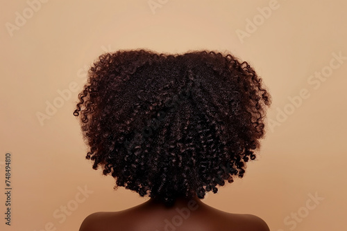 Portrait of woman with natural African American hair from rear view