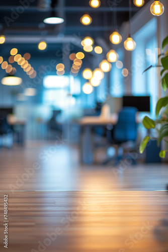 wooden table on blurred empty open space office. Abstract bokeh at office interior background for design.