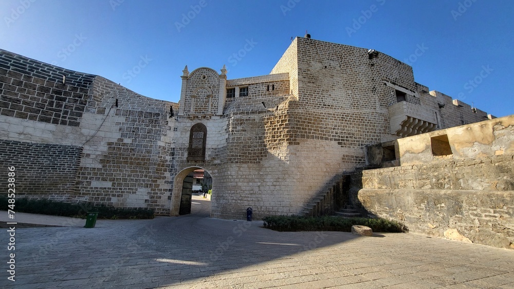 Obraz premium Diu, Dadra and Nagar Haveli and Daman and Diu India - Feb 23 2024: Diu fort - Built in the 16th century by the Portuguese, this sandstone fort features a lighthouse and 3 churches.