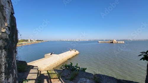 Diu, Dadra and Nagar Haveli and Daman and Diu India - Feb 23 2024: Diu fort - Built in the 16th century by the Portuguese, this sandstone fort features a lighthouse and 3 churches. photo