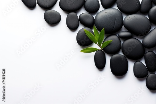Black spa stones isolated on white background with space for text.