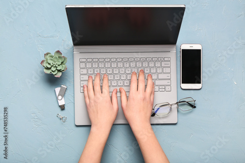 Female hands typing with la...