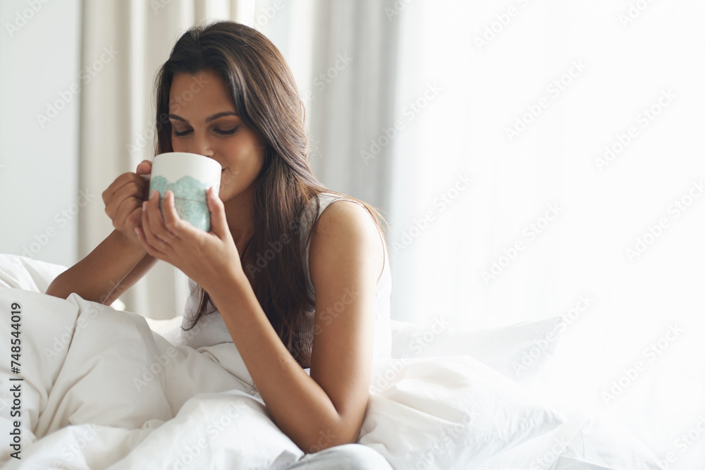 Smile, calm and woman with coffee in bedroom with caffeine to wake up in morning at home. Happy, relax and comfy young female person drinking mug of cappuccino, espresso or latte in apartment. Smile, calm and woman with coffee in bedroom with caffeine to wake up in morning at home. Happy, relax and comfy young female person drinking mug of cappuccino, espresso or latte in apartment.