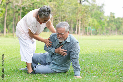 asian senior man fell down and having chest pain from heart attack in the park © offsuperphoto