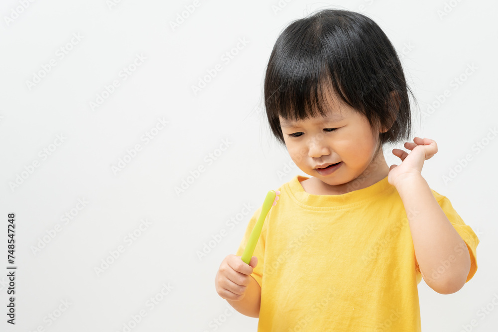 little asian girl feel toothache suffers from pain in tooth. Teeth decay, dental problems, child emotions and facial expression, oral health care, reducing sweets, fluorine coating little asian girl feel toothache suffers from pain in tooth. Teeth decay, dental problems, child emotions and facial expression, oral health care, reducing sweets, fluorine coating