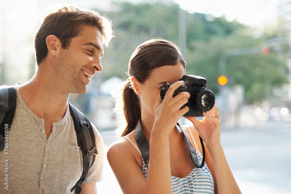 Couple, tourist and photographer in street for travel, sightseeing or happiness on holiday or vacation in Brazil. Camera, man and woman with smile in city road for explore, tourism or journey in town