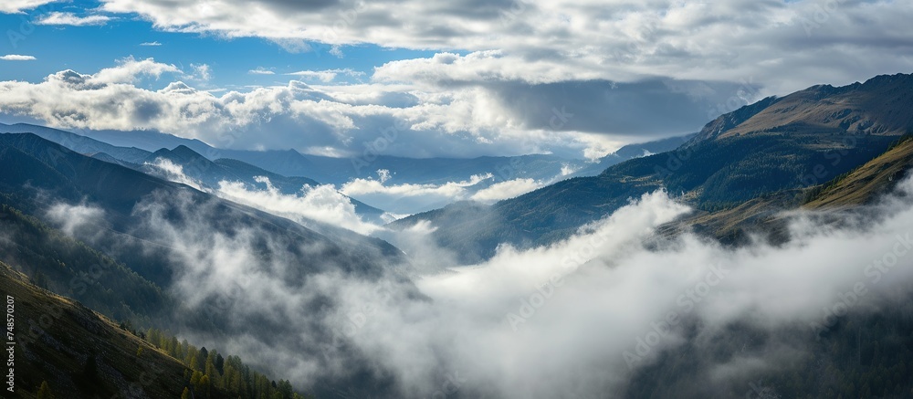 mountain views covered by thick clouds during the day. mountain views covered by thick clouds during the day.