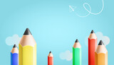 Colored pencils row on blue sky background with clouds, vector illustration