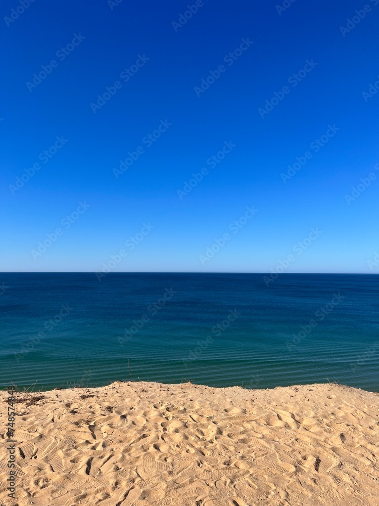 Sandstone rocky coast, blue ocean horizon, clear sky, ocean bay Sandstone rocky coast, blue ocean horizon, clear sky, ocean bay