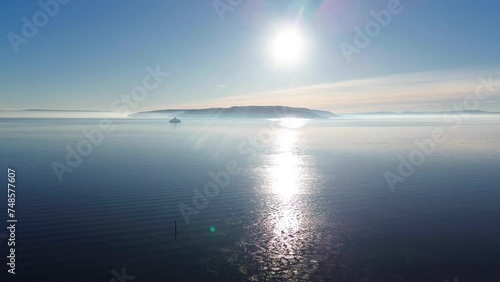 Sunrise over the sea. Icy waters during winter.  photo